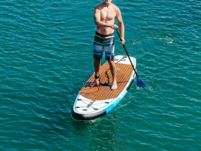 man paddleboarding in the sea
